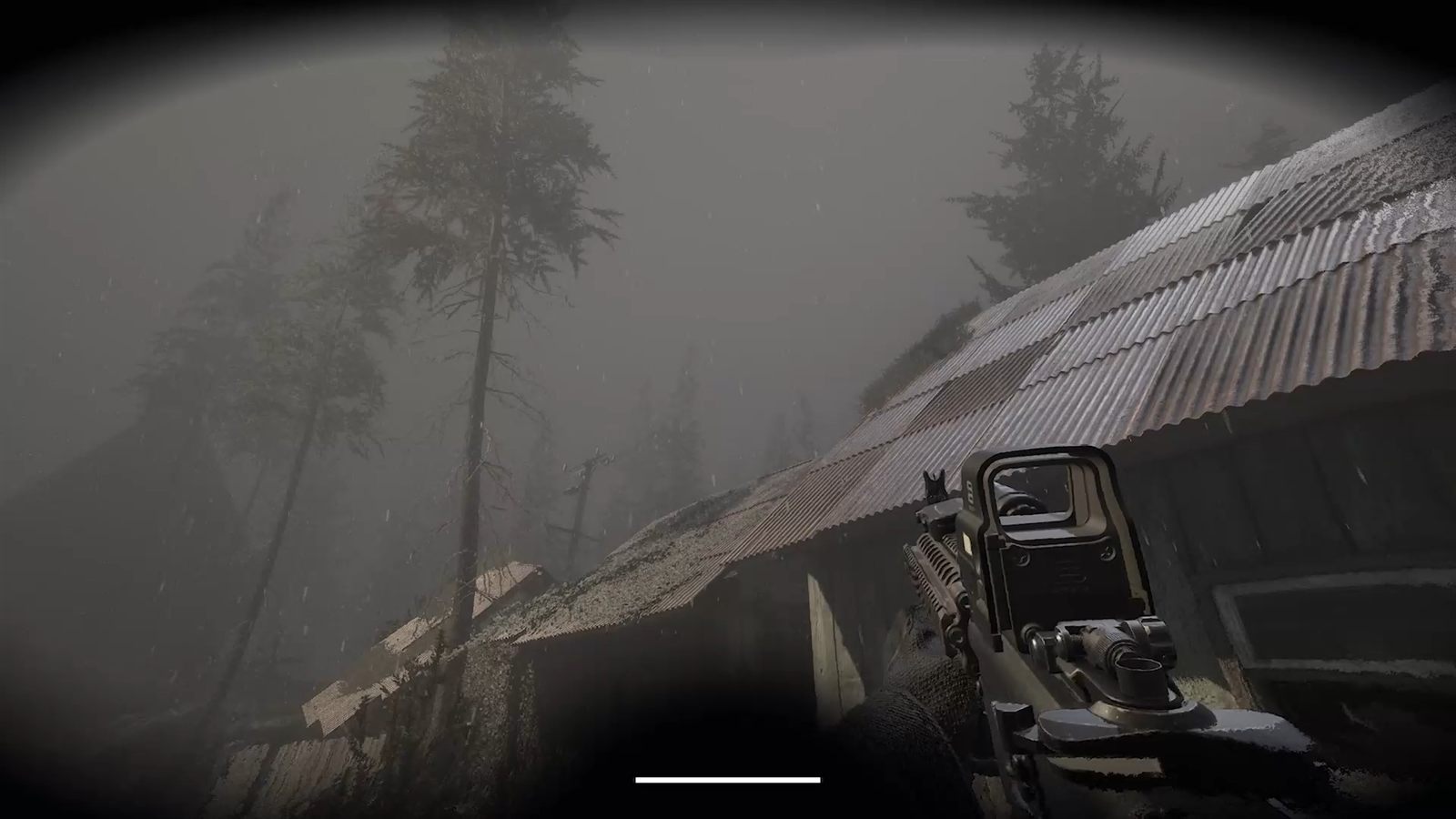 An operator's rifle aimed at a derelict barn in a foggy forest
