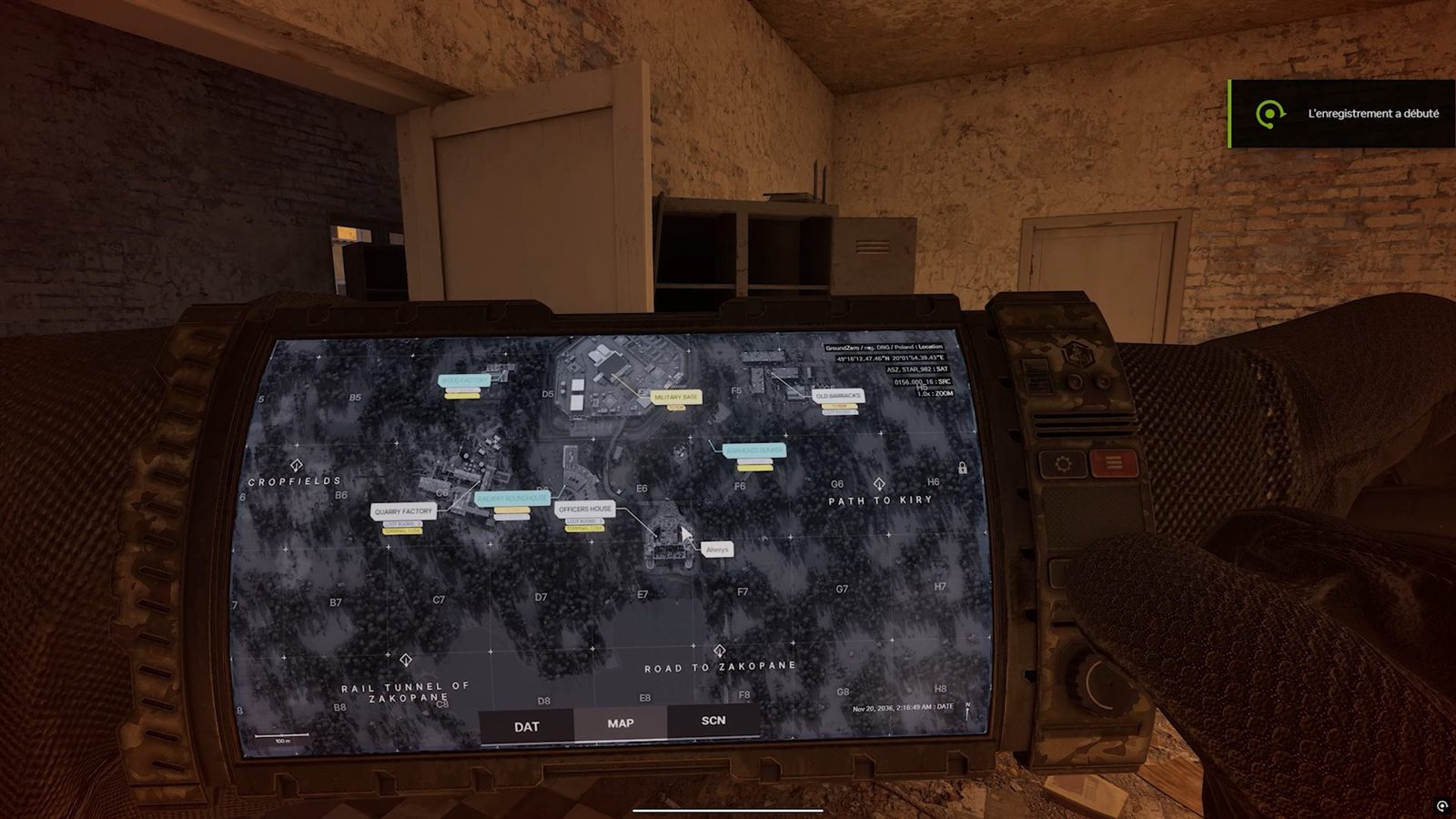 The PDA showing a top-down map with labelled markers