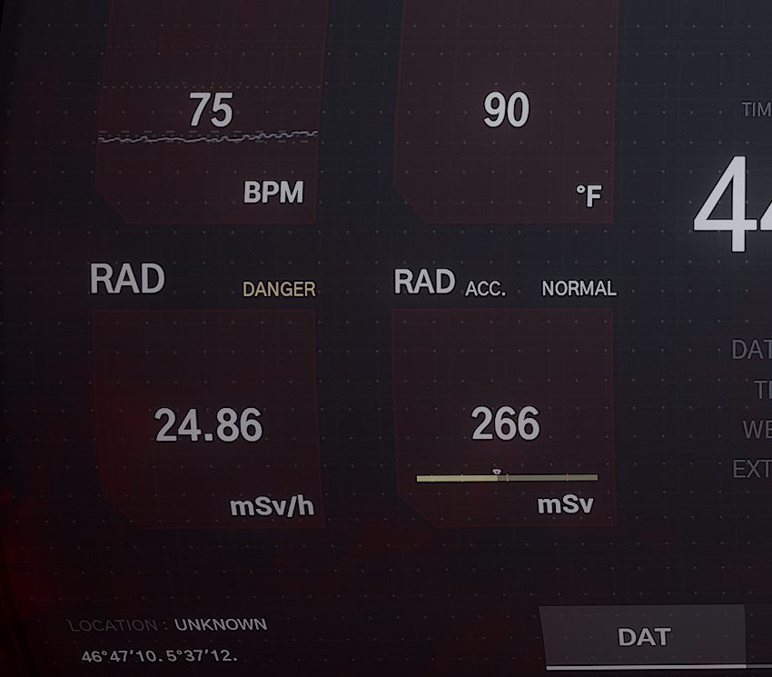 A PDA readout showing heart rate at 75 BPM, temperature, and radiation values in mSv per hour and accumulated mSv
