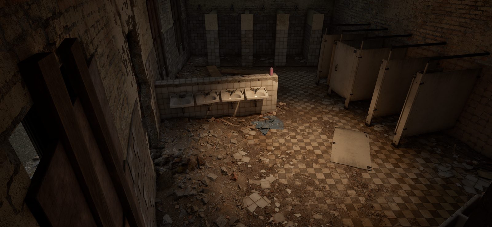 A wrecked washroom with toilet stalls and rubble on a checkered floor