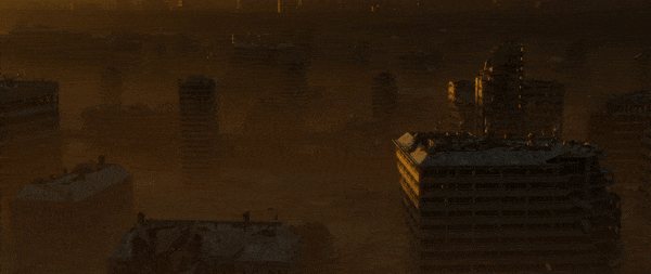 Tower blocks rising out of a yellow fog at sunset