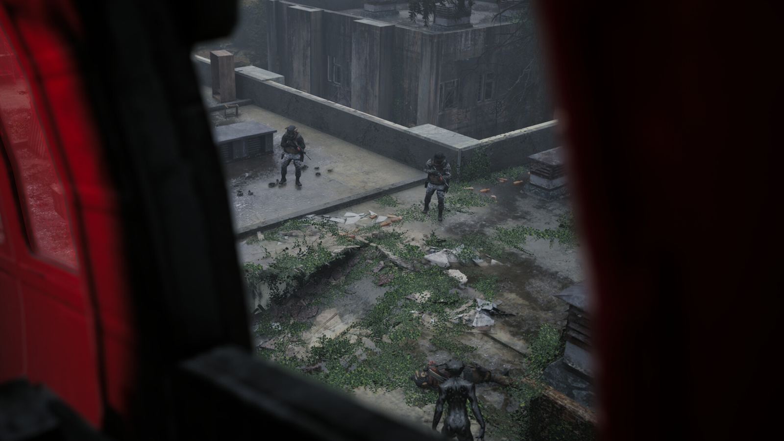 Looking down from the open door of the extraction helicopter at operators still on the ground below